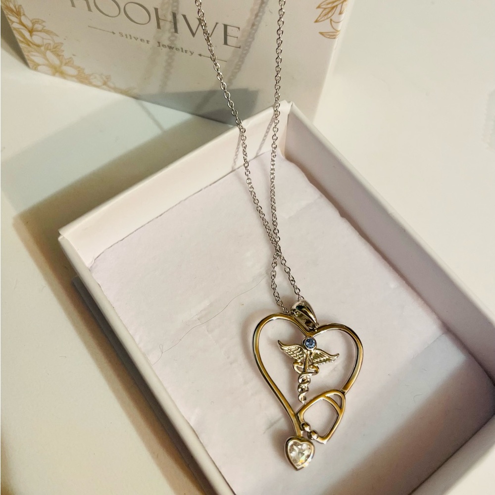This nurse necklace is made of 925 sterling silver. Cubic zirconia